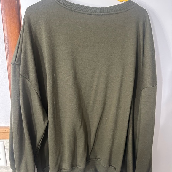 Green Sweater with soft texture. Mushroom designs covering front and worn once - Picture 2 of 3
